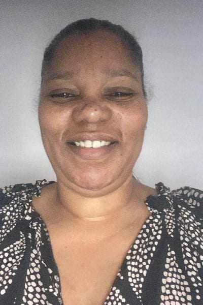 A headshot of Carol.